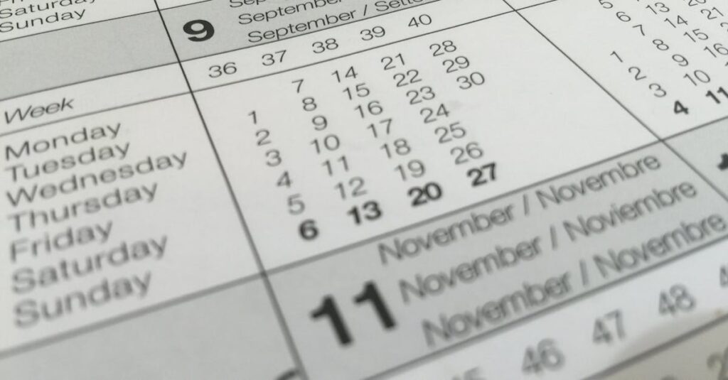 Detailed close-up of a calendar displaying months in several languages.